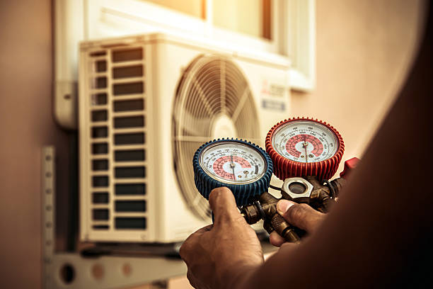 Professional Air Conditioning Service technician working in Marietta, OH